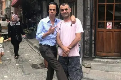 two men standing next to each other on a street at Newly-renovated apartment 1 in Istanbul