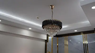 a chandelier hanging from a ceiling in a room at Taksim Armoni Hotel in Istanbul