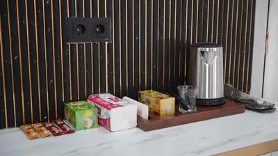 a counter with food and a coffee maker on it at Taksim Armoni Hotel in Istanbul