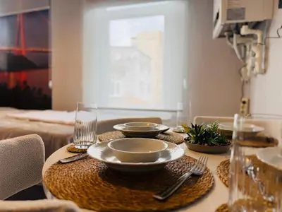 a table with plates and bowls on top of it at Cozy yellow home in Istanbul