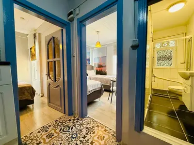 a room with a door leading to a bedroom at Cozy yellow home in Istanbul