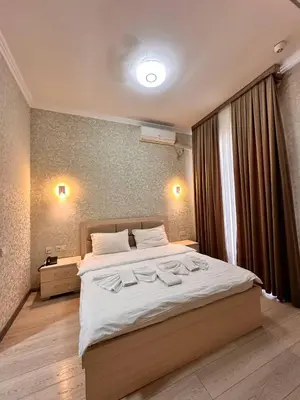 a bedroom with a large bed with white sheets at Elma hotel in Istanbul