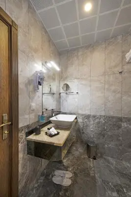 a bathroom with a sink and a toilet in it at Perapolis Hotel in Istanbul