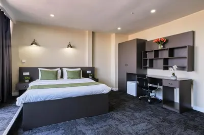 a bedroom with a bed and a desk and a computer at Duck Hotel in Istanbul