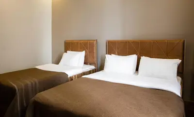 two beds sitting next to each other in a room at Taksm Mood in Istanbul