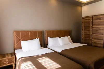 two beds sitting next to each other in a room at Taksm Mood in Istanbul