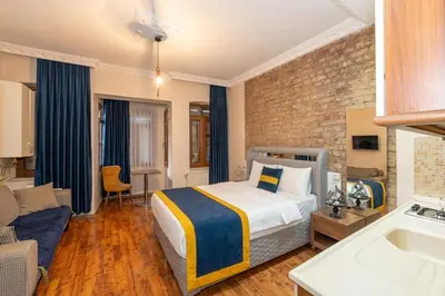 a bedroom with a bed and a living room at Opêra house taksim in Istanbul