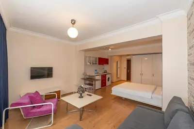 a living room with a bed and a table at Opêra house taksim in Istanbul