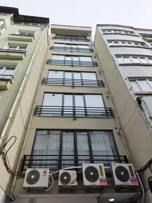 a tall building with air conditioners on the side of it at Birru Suites in Istanbul