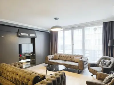 a living room with two couches and a television at Birru Suites in Istanbul