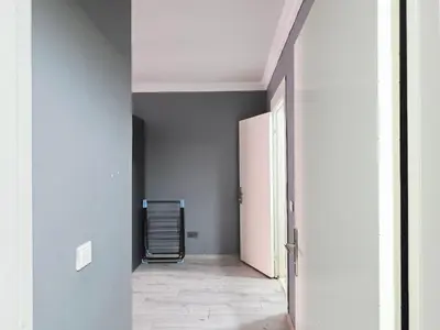 an empty hallway with a door and a room at Birru Suites in Istanbul