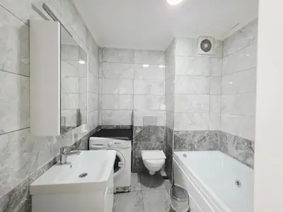 a bathroom with a sink and a toilet and a tub at Birru Suites in Istanbul