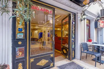 a large glass door to a big apple store at Big Apple hotel istanbul in Istanbul
