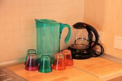 a kitchen counter with a tea kettle and cups on it at Newly-renovated apartment 2 in Istanbul