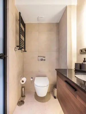 a bathroom with a toilet and a sink at Historic34 Modern Cozy Apartment Golden Horn in Istanbul