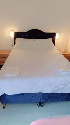 a large white bed with two pillows on it at Üsküdar Sahil Konaklama in Istanbul