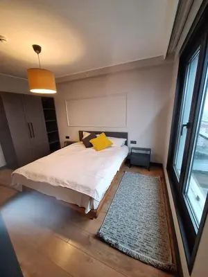a bedroom with a bed and a large window at Imperium Living in Istanbul