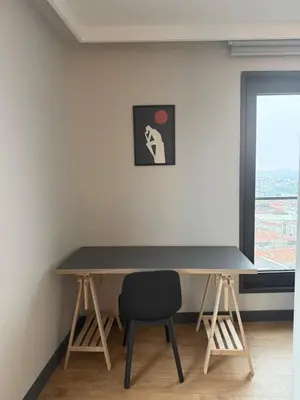a desk in a room with a chair and a window at Imperium Living in Istanbul