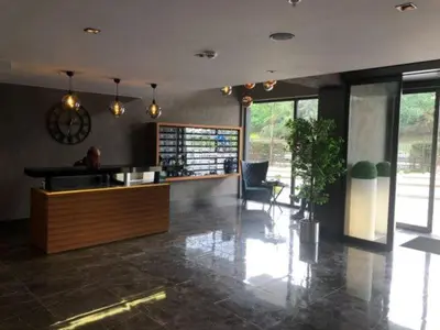 a large room with a lobby with a table and chairs at Imperium Living in Istanbul