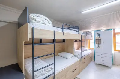 a bunk bed room with three bunk beds in it at Çatal hostel in Istanbul