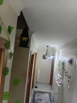 a room with a hallway with a staircase and a light at Sağlam Apartments in Istanbul