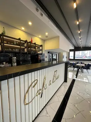 a fast food restaurant with a sign on the counter at İstanbul Paradise Hotel in Istanbul