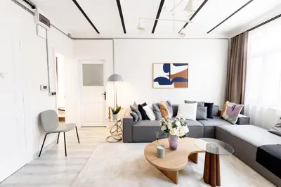 a living room with a couch and a table at Stylish Modern Flat Steps from Istiklal in Istanbul
