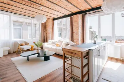 a living room with a couch and a table at Stunning City View Luxury Flat by Galata Metro in Istanbul