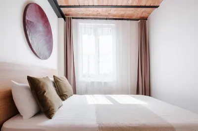 a bedroom with a white bed with a window at Stunning City View Luxury Flat by Galata Metro in Istanbul