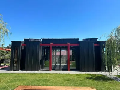 a black and red building with glass doors at Baraka 2 in İznik