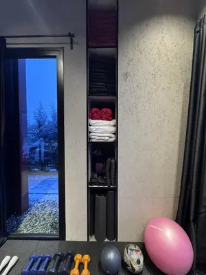 a mirror on a wall with a shelf with towels at Baraka 2 in İznik