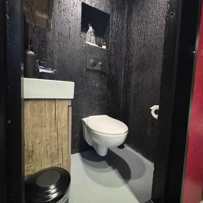 a bathroom with a white toilet and a sink at Baraka 2 in İznik