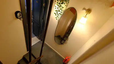 a mirror hanging on a wall next to a staircase at Marine Suite in Istanbul