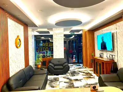 a living room with a couch and two chairs at Nera Otel in Istanbul