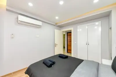 a bedroom with a bed in a white room at Amoria House Sultanahmet in Istanbul