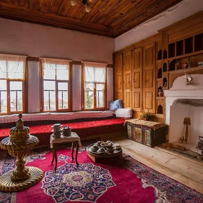 a large living room with a couch and a fireplace at sakarya erenlerde köy konsepti doğal yaşam evi in Erenler