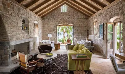 a living room with a couch and a fireplace at sakarya erenlerde köy konsepti doğal yaşam evi in Erenler