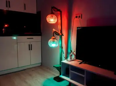 a living room with two lights and a tv at House in Istanbul