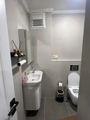 a small bathroom with a sink and a toilet at House in Istanbul