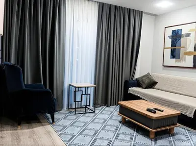 a living room with a bed and a coffee table at House in Istanbul