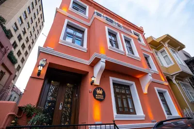 a orange building with a sign on it at King Suite Hotel Beşiktaş in Istanbul