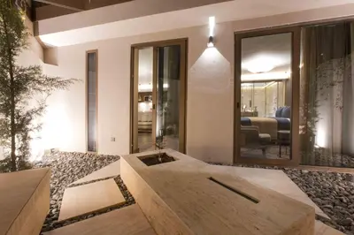 a bathroom with a wooden tub in the middle of a room at Noble22 Suites-Special Category in Istanbul