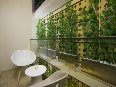 a room with a wall with plants on it at Maroon Hotel Pera in Istanbul