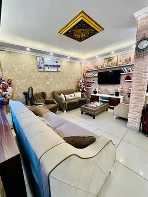 a living room with a couch and a tv at Liman Hotel in Istanbul