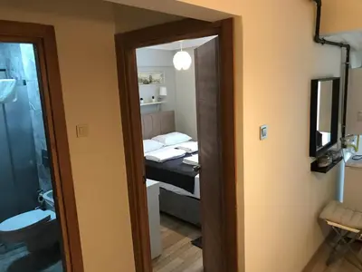 a bathroom with a toilet and a sink at Goji's Apartments in Istanbul