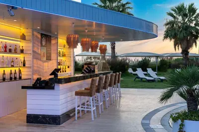 a bar at a resort with chairs and tables at Radisson Blu Hotel Istanbul Ottomare in Istanbul