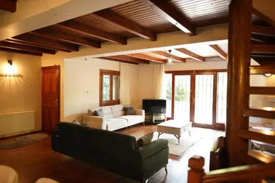 a living room with a couch and a tv at Sapanca Vi̇lla Bahce Şükriye Küçükal in Sapanca