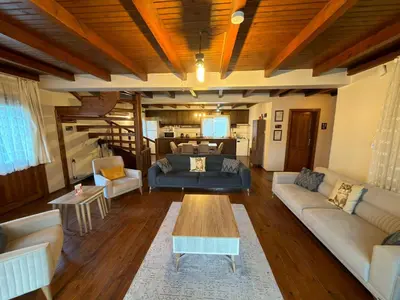 a living room with couches and a coffee table at Sapanca Vi̇lla Bahce Şükriye Küçükal in Sapanca