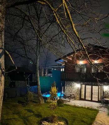 a house lit up at night with lights at Sapanca Vi̇lla Bahce Şükriye Küçükal in Sapanca