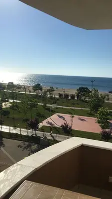 a view of the ocean from a balcony of a building at Lapina Suite & Restaurant in Cebeci